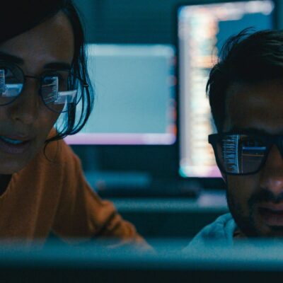 AI developers collaborate around computer