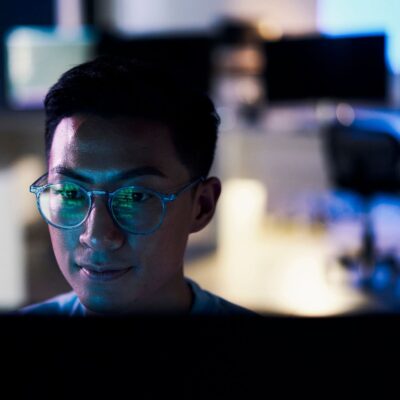 Young employee using AI to assist with complex business decisions