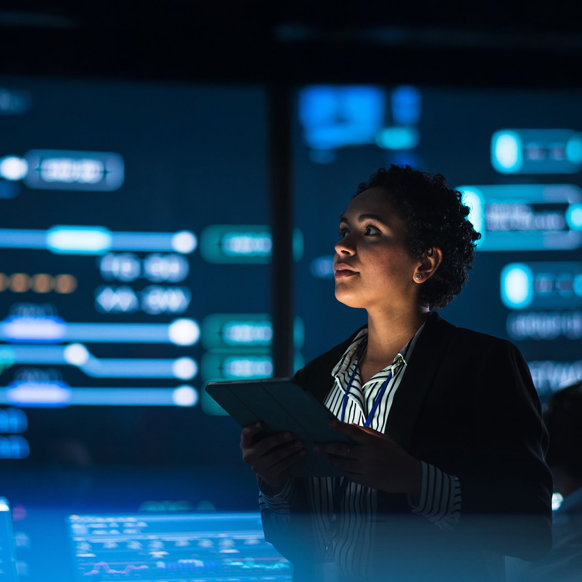 Woman with tablet with digital background
